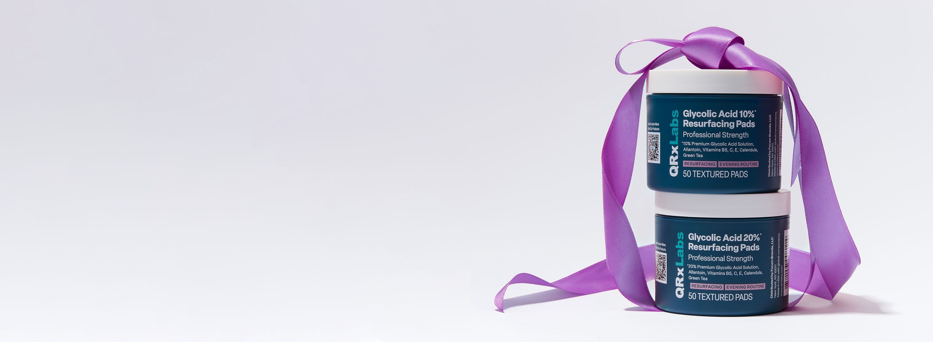 Banner showing two Glycolic Acid products stacked on top of each other with a purple bow.
